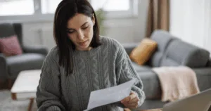 Woman checking her monthly expenses and statements